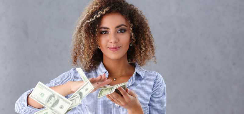 A woman seemingly throwing away cash