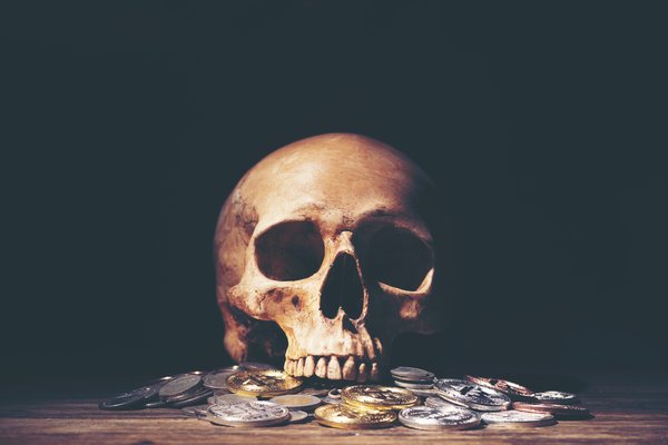 Skull with scattered coins