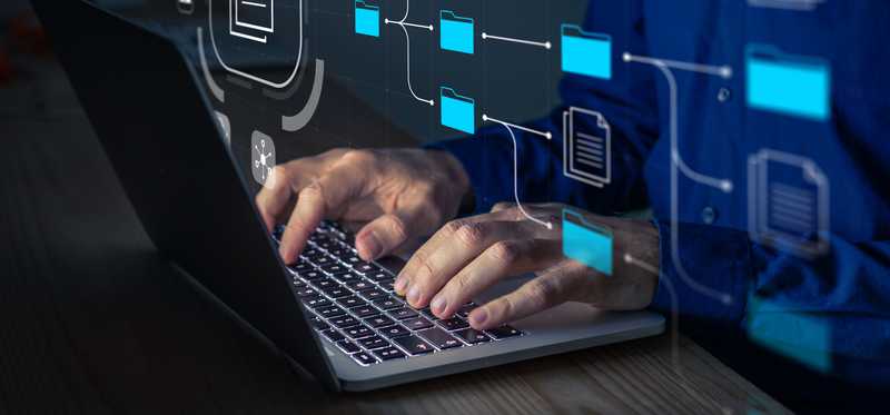 A laptop computer and floating icons.