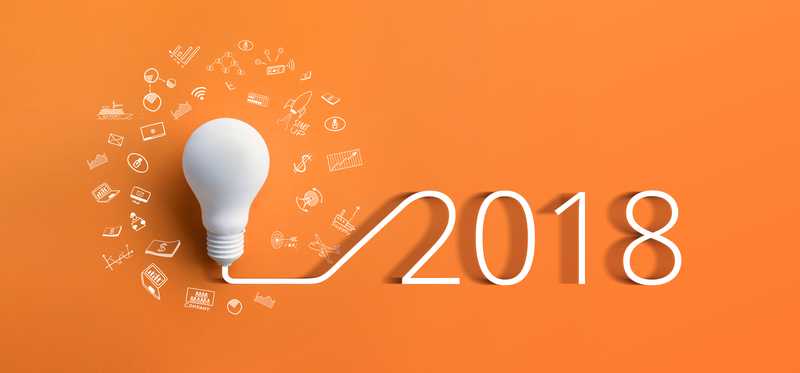 On an orange background, "2018" is connected via lines to a lightbulb surrounded by tech symbols like Wifi and bluetooth