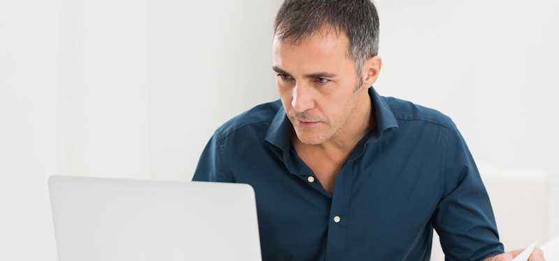 Person working at laptop.