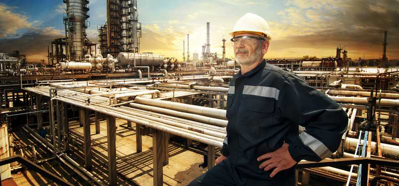 Person at work at a refinery or chemical plant.