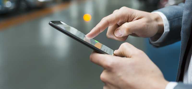 Person checking a cell phone.