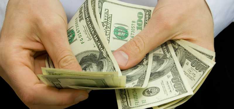 Person counting bills.