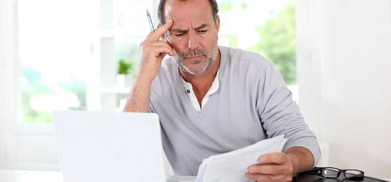Person looking at document puzzled.