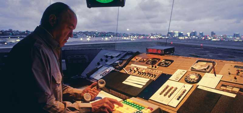 Man working in air traffic control tower.