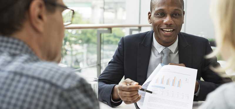 Mature couple talking to a financial advisor