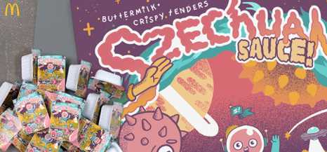A poster for Szechuan sauce with some sauce packets sitting on top of it.