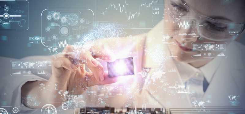 Person holding microchip electronic technology.