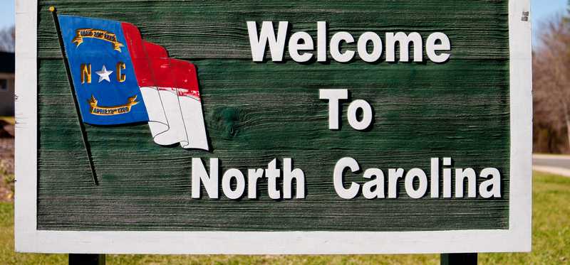 A highway road sign that reads Welcome to North Carolina.