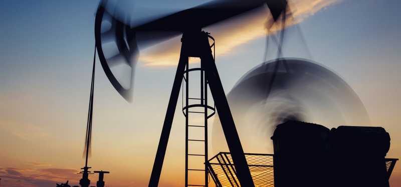An oil or gas pumpjack in motion.