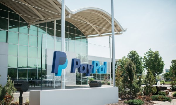 Exterior of Paypal's Omaha office with logo sign in front.