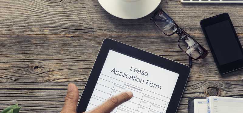 Tablet with an online lease application for a rental property.