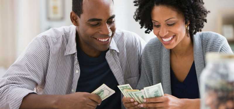 A couple counting lots of cash.