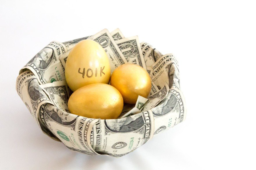 Three eggs in a basket made of dollar bills with 401(k) written on one of the eggs.
