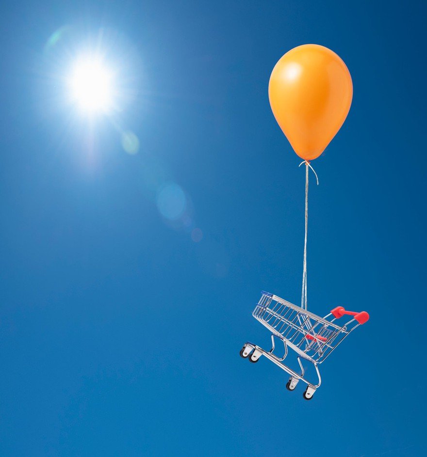 Balloon carrying shopping cart.