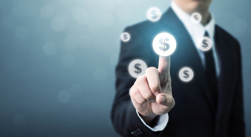 Man in a suit presses digital coins.