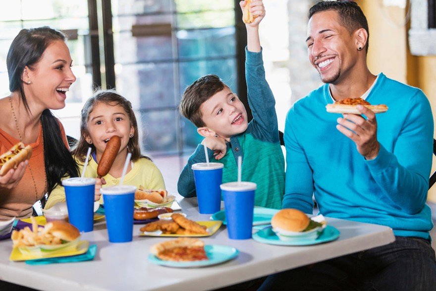 family enjoys fast food meal together