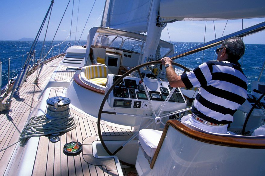 Man steering boat.