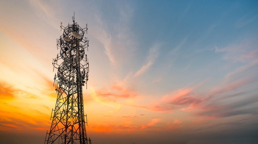 A telecommunications tower at sunset.