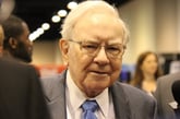 Warren Buffett with people in the background