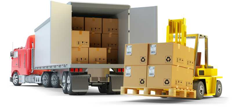 Boxes being unloaded from a truck with a forklift