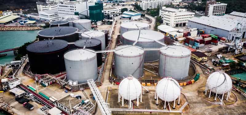 Large holding tanks at a refinery.
