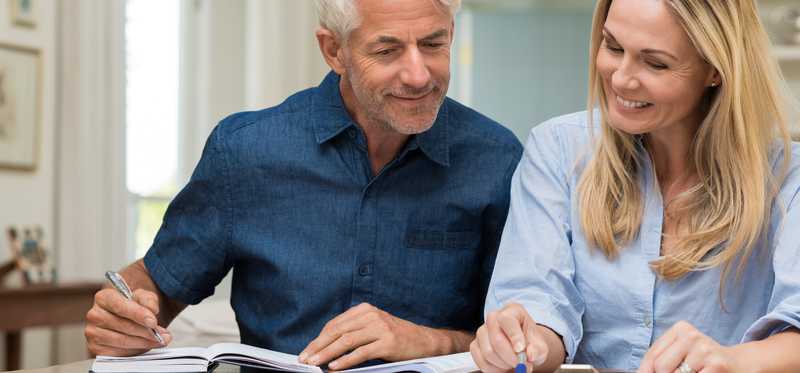 Two people looking at documents.