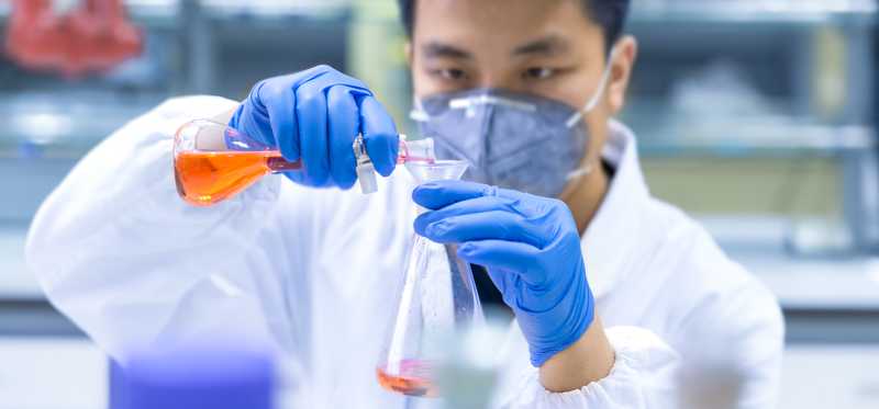 Scientist testing samples in lab