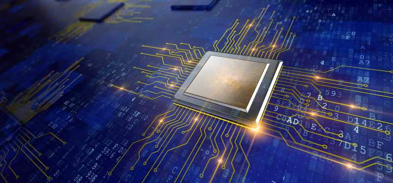 A semiconductor chip on blue board.