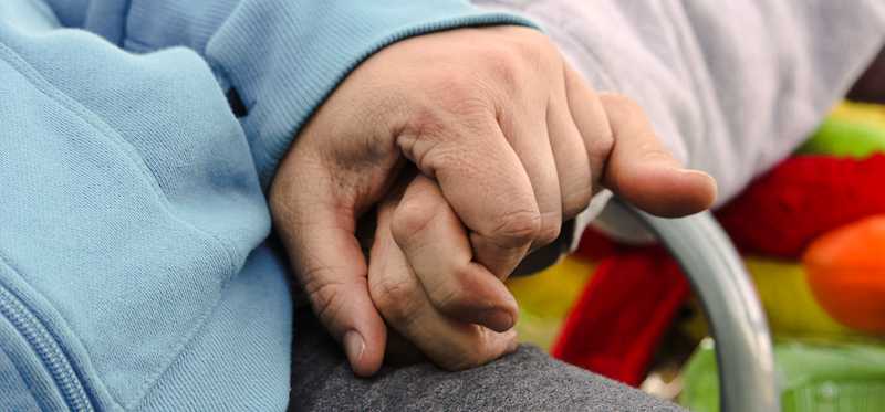 Seniors holding hands
