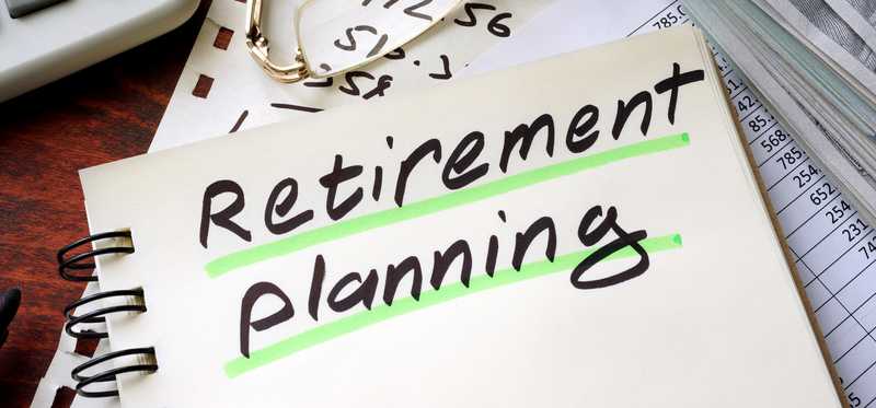 Notebook with Retirement Planning written in it