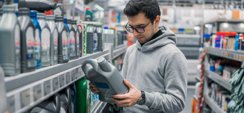 Person shopping in an auto parts store.