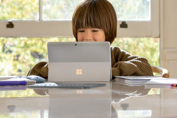 Child using a Microsoft Surface.