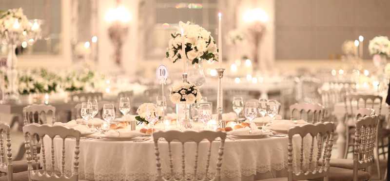A very elegant dining room prepared for dinner service.