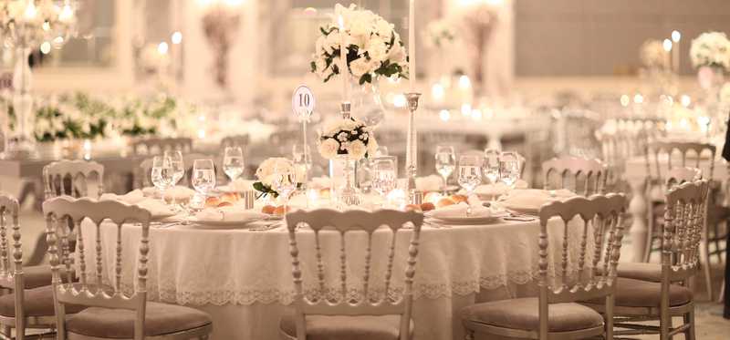 A banquet hall set up for a fancy party.