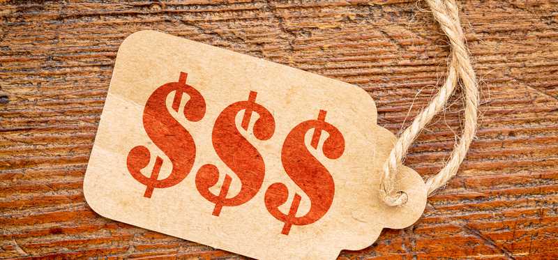 A sales tag with dollar signs on it