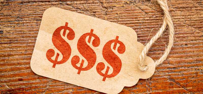 A sales tag with dollar signs on it