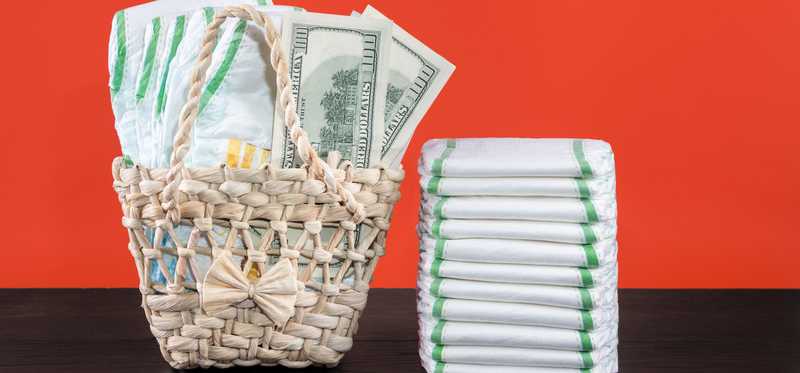 A basket of diapers and cash.