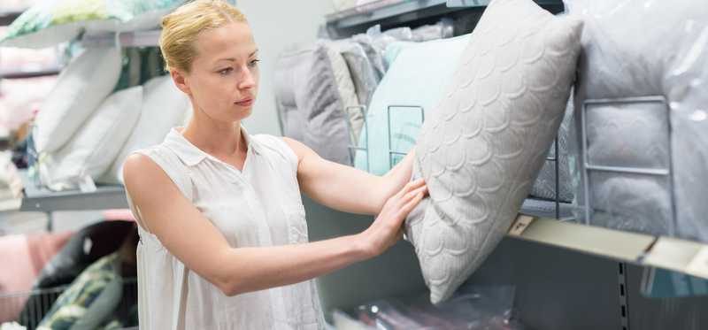 Person shopping for pillows.
