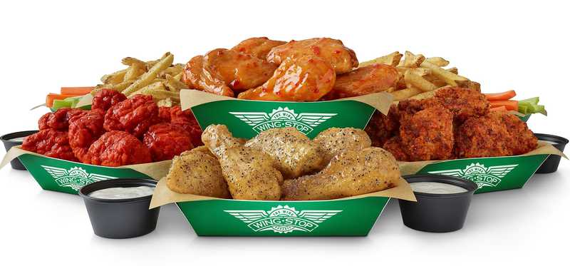 Baskets of wings with various sauces