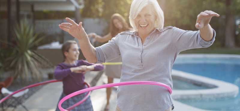 People playing with Hula Hoops.
