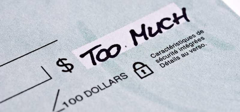 A check with Too Much written in the amount field.