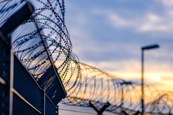 Barbed wire atop prison wall