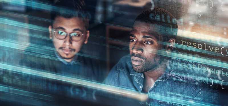Two people with computer coding superimposed on them.
