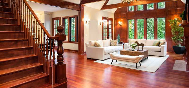 A large, bright entryway with nice hardwood flooring.