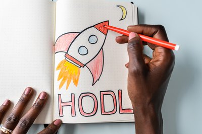 Meme stock illustration showing rocket and the word HODL.