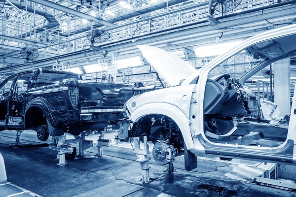 An auto assembly line with vehicles in process.