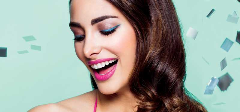 Model wearing brightly colored makeup.