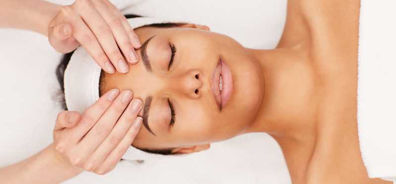 Woman receiving massage at a spa